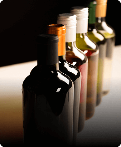 assorted wine bottles arranged in a row