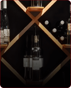 wine bottles displayed in a wooden rack