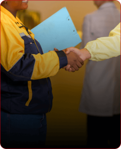 distribution partners shaking hands, including a worker in a high visibility jacket