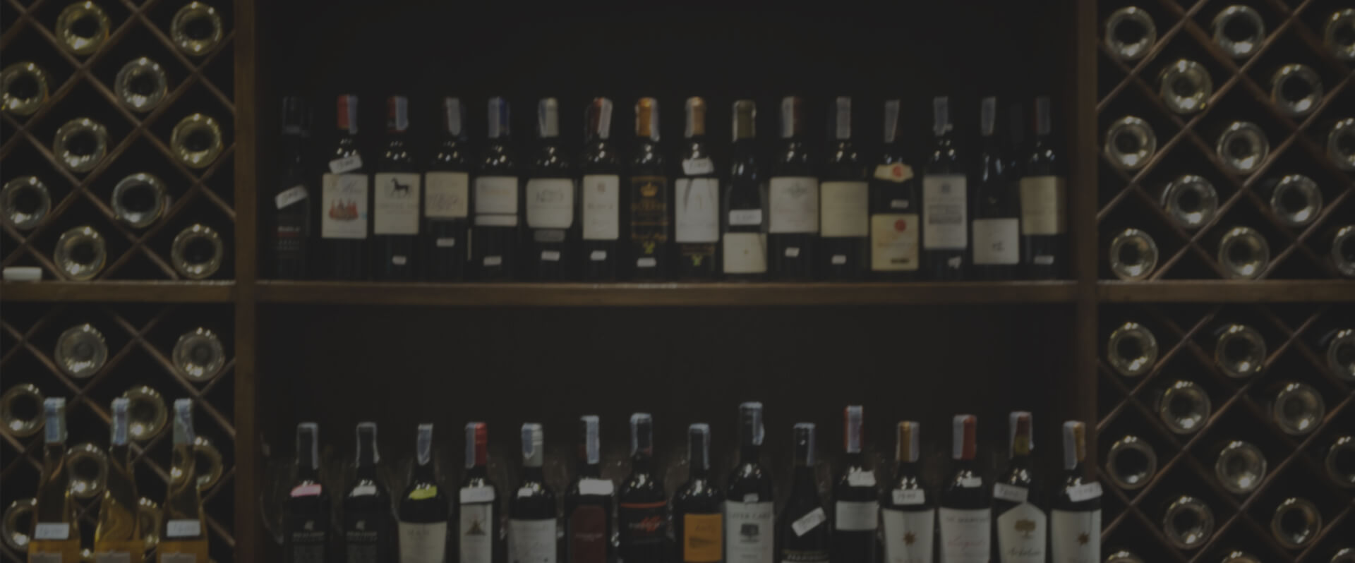 wine bottles stored horizontally in wooden cellar racks